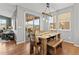 Dining room with sliding doors to backyard and wood table at 9295 Dunraven Loop, Arvada, CO 80007