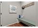 Small entryway with built-in bench and wall art at 9295 Dunraven Loop, Arvada, CO 80007