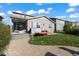 Back exterior view of house with deck and grassy yard at 9295 Dunraven Loop, Arvada, CO 80007