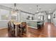 Open concept kitchen and dining area with hardwood floors at 9295 Dunraven Loop, Arvada, CO 80007