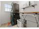 Convenient laundry room with stackable washer and dryer at 9295 Dunraven Loop, Arvada, CO 80007