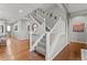 Modern staircase with gray carpeting and white railings at 9295 Dunraven Loop, Arvada, CO 80007