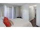Bright bedroom featuring sliding glass door, neutral walls, and modern accents at 5873 S Prince St # 117C, Littleton, CO 80120