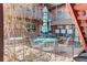 Courtyard area with blue tables and seating, surrounded by multi-level building at 5873 S Prince St # 117C, Littleton, CO 80120