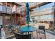 Courtyard area with blue tables and seating, surrounded by multi-level building at 5873 S Prince St # 117C, Littleton, CO 80120