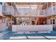 A multi-story exterior with parking, featuring wood patios and stairs, offering a unique residential aesthetic at 5873 S Prince St # 117C, Littleton, CO 80120