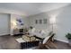 Charming living room with a comfortable sofa, stylish decor, and plenty of natural light for a relaxing ambiance at 5873 S Prince St # 117C, Littleton, CO 80120