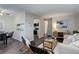 Open layout of living and dining areas with modern furnishings, creating a stylish and functional space at 5873 S Prince St # 117C, Littleton, CO 80120