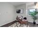 Cozy office space featuring a wooden desk with a black and white rug and natural light at 5873 S Prince St # 117C, Littleton, CO 80120