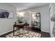 Cozy office space with desk, bookshelf, decor, and natural light at 5873 S Prince St # 117C, Littleton, CO 80120
