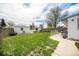 Spacious backyard with a manicured lawn, offering ample space for recreation and relaxation at 390 Yates St, Denver, CO 80219