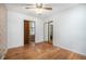 Spacious bedroom with hardwood floors and a ceiling fan provides a comfortable retreat at 390 Yates St, Denver, CO 80219