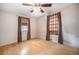 Bedroom with wood floors, natural light, and neutral walls at 390 Yates St, Denver, CO 80219