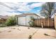 One car detached garage providing parking and storage space, complemented by a paved driveway at 390 Yates St, Denver, CO 80219