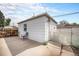 Detached one car garage offering secure parking and additional storage with a gated entrance at 390 Yates St, Denver, CO 80219
