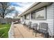 Relaxing patio area with outdoor seating, ideal for enjoying the fresh air and backyard views at 390 Yates St, Denver, CO 80219