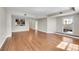 Open-concept living area with hardwood floors, natural light, and access to the kitchen at 300 W 11Th Ave # 8C, Denver, CO 80204