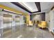 Bright lobby with comfortable seating, a fireplace and easy access to elevators at 300 W 11Th Ave # 8C, Denver, CO 80204