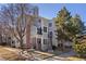 Well-maintained condo exterior with brick accents and mature trees at 5550 W 80Th Pl # 23, Arvada, CO 80003