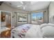 Bright bedroom featuring two windows, ceiling fan, and hardwood floors at 5550 W 80Th Pl # 23, Arvada, CO 80003