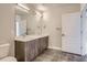 Bathroom with a double sink vanity, modern fixtures, and ample counter space at 20 Wilcox St # 316, Castle Rock, CO 80104
