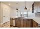 Stylish kitchen with a breakfast bar, stainless steel dishwasher, and modern pendant lighting at 20 Wilcox St # 316, Castle Rock, CO 80104