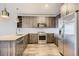 Modern kitchen featuring stainless steel appliances, sleek cabinets, and quartz countertops at 20 Wilcox St # 316, Castle Rock, CO 80104