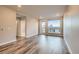 Bright living room featuring modern hardwood floors, ample natural light, and neutral wall colors at 20 Wilcox St # 316, Castle Rock, CO 80104