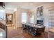 Elegant dining area with hardwood floors, a large table, and modern chandelier at 402 Garfield St, Denver, CO 80206