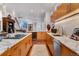 Open concept kitchen with marble island and custom wood cabinetry at 402 Garfield St, Denver, CO 80206