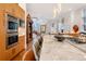 Spacious kitchen with double ovens, custom cabinetry, and marble countertops at 402 Garfield St, Denver, CO 80206