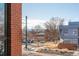 Sunny street view with mountain backdrop; charming homes and landscaping at 402 Garfield St, Denver, CO 80206