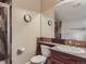 This updated bathroom features a shower with glass door, a neutral color scheme, and modern fixtures at 12745 Uinta St, Brighton, CO 80602