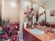 Elegant powder room with marble countertop, decorative mirror, and stylish fixtures and decorations at 12745 Uinta St, Brighton, CO 80602