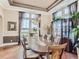 Elegant dining room featuring a large table, a chandelier, and ample natural light, perfect for hosting gatherings at 12745 Uinta St, Brighton, CO 80602