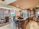 Gourmet kitchen featuring an island with seating, stainless steel appliances, and custom cabinetry, perfect for culinary enthusiasts at 12745 Uinta St, Brighton, CO 80602