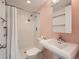Bathroom with a shower and pedestal sink at 1250 N Humboldt St # 201, Denver, CO 80218
