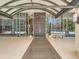 Grand building entrance with double doors, high ceilings, and manicured landscaping at 1250 N Humboldt St # 201, Denver, CO 80218