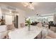 Bright dining area with a modern table, seating, and an open layout to the kitchen and living area at 1250 N Humboldt St # 201, Denver, CO 80218