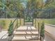 Secured entry gate with steps, providing access to a private outdoor area at 1250 N Humboldt St # 201, Denver, CO 80218
