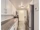 Efficient kitchen features stainless steel appliances, subway tile backsplash, and ample counter space at 1250 N Humboldt St # 201, Denver, CO 80218