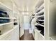 Organized walk-in closet with custom shelves and drawers, maximizing storage space at 7255 E Quincy Ave # 309, Denver, CO 80237