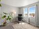 Well-lit bedroom with large windows, modern furnishings, and plush carpet at 8199 Welby Rd # 1102, Denver, CO 80229