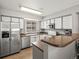 Bright kitchen with stainless steel appliances and plenty of counter space at 8199 Welby Rd # 1102, Denver, CO 80229