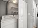 A bright, convenient laundry area features a modern washer and dryer setup at 8199 Welby Rd # 1102, Denver, CO 80229