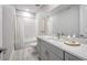 Well-lit bathroom featuring a shower-tub, vanity with modern fixtures, and tile floors at 23731 E 40Th Ave, Aurora, CO 80019