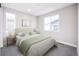 Sunlit bedroom with plush carpet, large windows, and neutral decor for a calming atmosphere at 23731 E 40Th Ave, Aurora, CO 80019