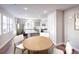 Open kitchen with gray cabinets, stainless steel appliances, quartz countertops, and a central island with seating at 23731 E 40Th Ave, Aurora, CO 80019
