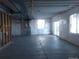 Spacious unfinished basement with concrete floor and sliding glass doors at 1153 Elbridge Dr, Elizabeth, CO 80107