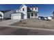 Charming two-story home with a two-car garage and landscaped front yard at 1153 Elbridge Dr, Elizabeth, CO 80107